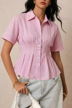 Pink striped short-sleeve button-up blouse with peplum hem and gathered waist perfect for casual wear