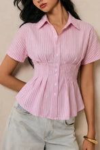 Pink short-sleeved button-up blouse with vertical stripes and peplum hem ideal for casual or office wear