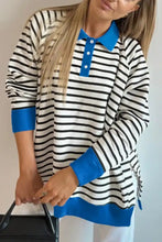 A black and white striped long sleeve sweatshirt with bold blue collar cuffs and hem, slightly stretchy and machine wash cold
