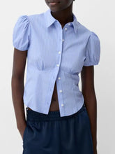 Light blue and white vertically striped puff sleeve fitted shirt with short sleeves and button-up front