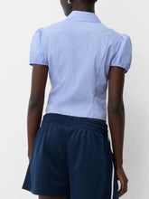 Light blue and white striped puff sleeve fitted shirt with short puffed sleeves ideal for casual wear