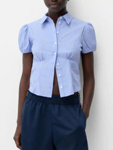 Light blue and white striped puff sleeve fitted shirt with short puffed sleeves and button-up front for a stylish look