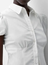 White short-sleeved fitted shirt with puffed sleeves and classic collar featuring striped puff sleeve detailing