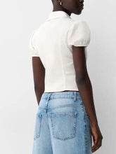 White fitted shirt with puffed sleeves and collar featuring a striped puff sleeve fitted design