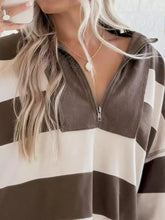 Brown and white striped quarter zip long sleeve sweatshirt in corduroy fabric with machine wash care instructions