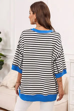 Women’s striped round neck half sleeve t-shirt in black and white with blue trim
