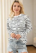 Striped round neck long sleeve T-shirt with distressed denim shorts