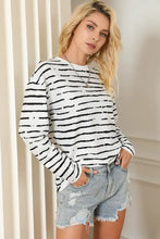 Striped round neck long sleeve T-shirt in white with black stripes