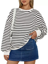 Black and white horizontally striped oversized casual sweatshirt with round neck slightly stretchy fabric machine wash cold tumble dry low