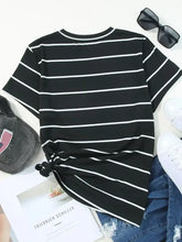 Striped round neck short sleeve t-shirt with black and white horizontal stripes and knotted hem