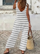 Striped round neck wide leg jumpsuit in black and white stripes