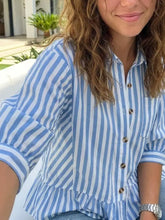 Blue and white vertically striped ruffle hem button-down shirt with puff sleeves in lightweight fabric