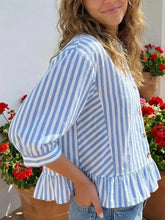 Light blue and white striped ruffle hem button-down shirt with three-quarter sleeves and button closures
