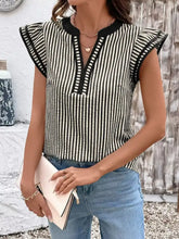 Black and white vertically striped ruffle sleeve blouse with sleeveless design and detailed shoulder ruffles