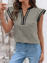 Black and cream vertical striped ruffle sleeve blouse with sleeveless design and ruffled shoulder details