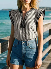 Black and white striped ruffle sleeve blouse with vertical stripes and sleeveless ruffle shoulder details