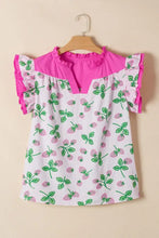 A vibrant pink and white strawberry print color block patchwork flutter sleeve blouse with ruffled sleeves and collar