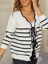 Striped tie front knit cardigan in white black horizontal stripes color palette slightly stretchy