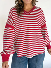 Striped v-neck long sleeve sweatshirt in red and white with ribbed cuffs made for machine wash cold care
