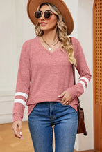 Women’s pink long sleeve V-neck top with white arm stripes