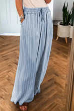 Light blue striped wide leg jeans with a drawstring waistband in soft denim fabric for comfortable casual wear