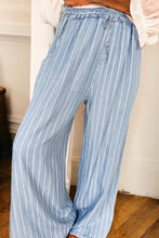 Light blue and white striped wide leg jeans with elastic waistband in a comfortable wide leg design