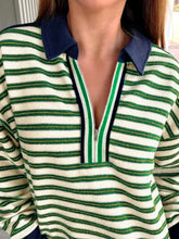 Striped zip-up collar sweatshirt in green and white stripes with navy collar made of slightly stretchy material