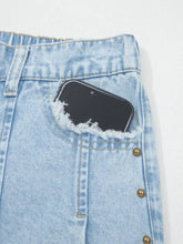 Light blue denim wide-leg jeans with slit leg frayed hem and gold-tone studs along the side seam