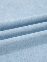 Light blue denim wide-leg jeans with studded side slit leg frayed details and a soft faded texture