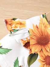 Sunflower ruffled short sleeve top with sunflower-patterned oven mitts on white background