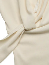 Cream-colored ribbed knit surplice cap sleeve bodysuit with a soft draped knot detail and cap sleeve design