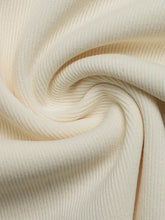 Cream-colored ribbed knit surplice cap sleeve bodysuit with soft stretchy texture and fitted silhouette