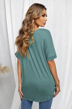 Solid green surplice half sleeve tunic top with curved hem