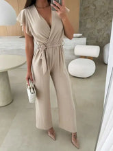 Surplice wide leg belted jumpsuit with flutter sleeves