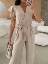 Surplice wide leg belted jumpsuit with flutter sleeves