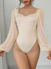 Cream-colored sweetheart neck balloon sleeve bodysuit with structured bust and sheer long puff sleeves in lightweight fabric