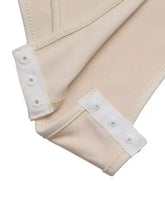 Beige stretchy leggings with white snap-button cuffs paired with a sweetheart neck balloon sleeve bodysuit