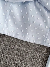 Light blue Swiss dot flounce sleeve blouse with delicate white floral embroidery perfect for elegant occasions