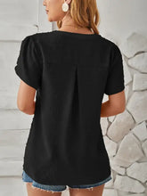 Swiss dot notched petal sleeve T-shirt with black top and denim shorts
