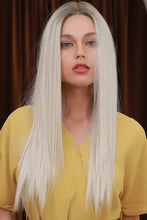 Woman in synthetic long straight platinum blonde wig with dark roots, heat safe