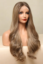 Synthetic long wave golden brown wig with cap included on mannequin