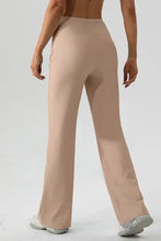 Tan high waisted flared yoga pants, highly stretchy and beige