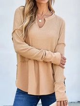 Tan waffle knit long sleeve top with v-neck and ribbed cuffs