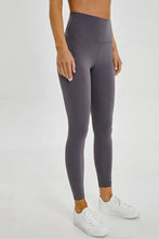 Taupe high waisted camouflage leggings with pocket detail