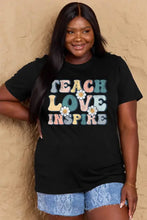 Black oversized plus size t-shirt with teach love inspire text and daisies