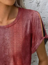 Teal green short sleeve printed round neck top with cut-out shoulders