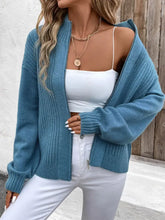 Teal ribbed zip-up cardigan with balloon sleeves and pockets