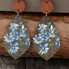 Pair of flower geometrical shape wooden earrings with blue and white floral teardrop design