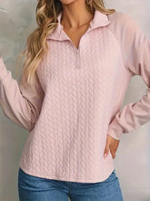 Light pink texture quarter zip long sleeve sweatshirt with quilted design