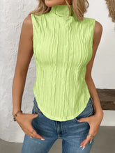 A vibrant lime green texture turtleneck sleeveless top with high neckline and vertical ribbed texture